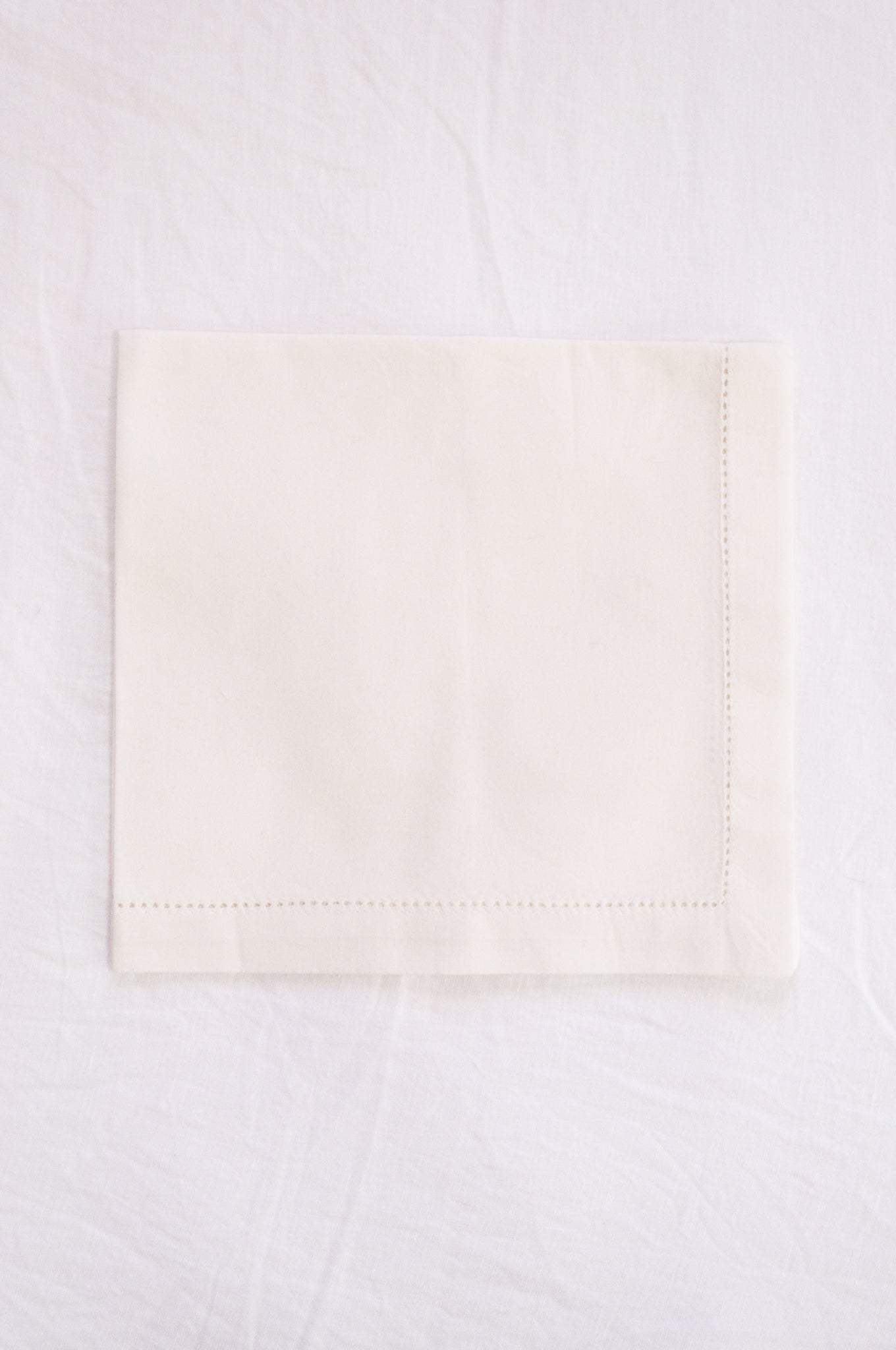 Plain cotton napkins with faggot hem detail in white.