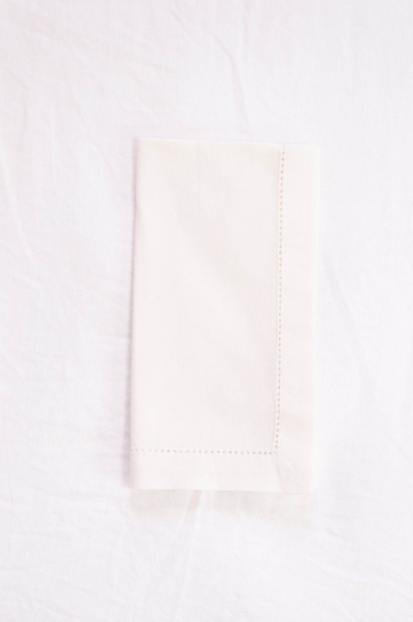 Plain cotton napkins with faggot hem detail in white.