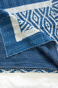 Indigo blue and white ikat print blockprint kantha quilt.