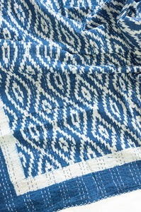 Indigo blue and white ikat print blockprint kantha quilt.