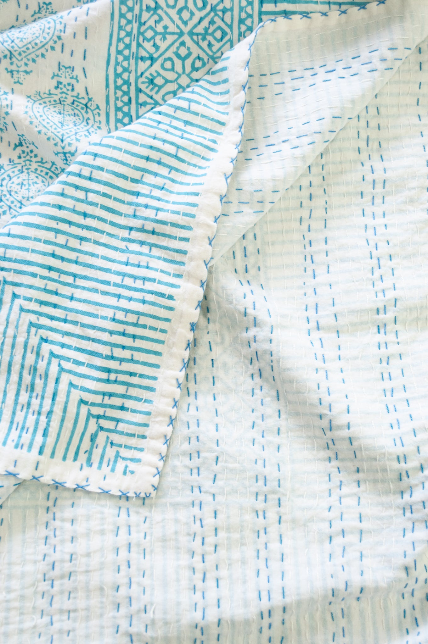 Aqua blue on white Mughal motif blockprint kantha quilt.