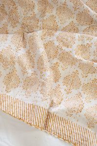 Mustard yellow on white Mughal motif blockprint kantha quilt.