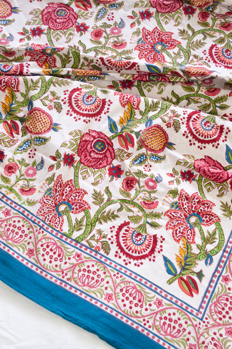 Floral blockprint large table cloth bedcover with pomegranates in pinks, red, blue and green.