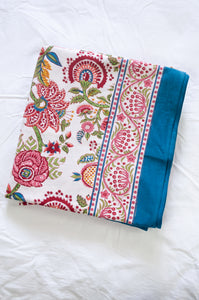 Floral blockprint large table cloth bedcover with pomegranates in pinks, red, blue and green.