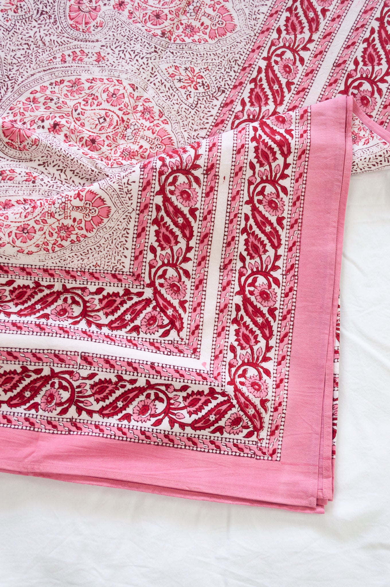 Pink and white paisley tablecloth, blockprinted by hand.