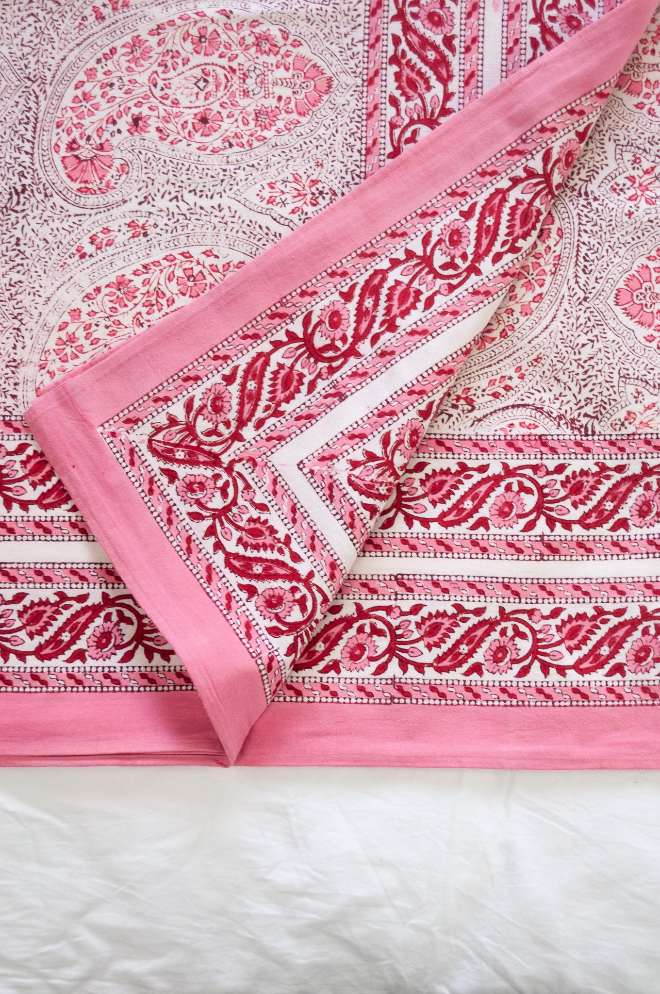 Pink and white paisley tablecloth, blockprinted by hand.
