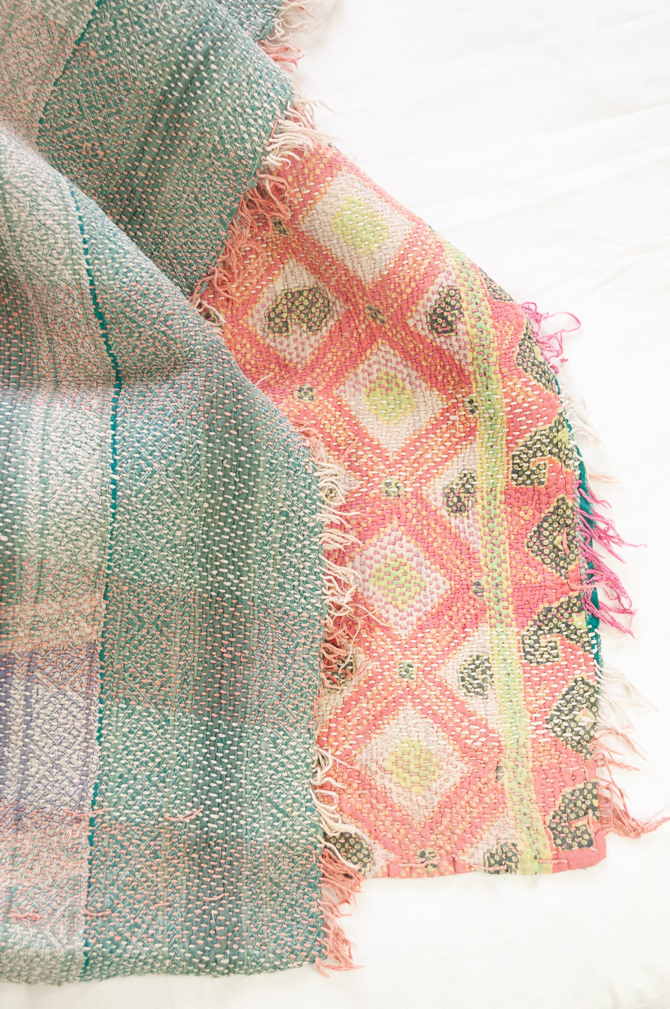 Vintage kantha quilt in pastel stripes and checks, with pattern  in pink, lavender and mint.