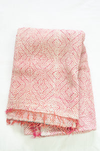 VIntage kantha quilt with  rose pink on white stitching and fringed edge.
