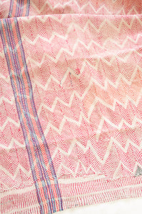 Vintage lohori wave stitched kantha quilt in  red, pink, green and blue on white.