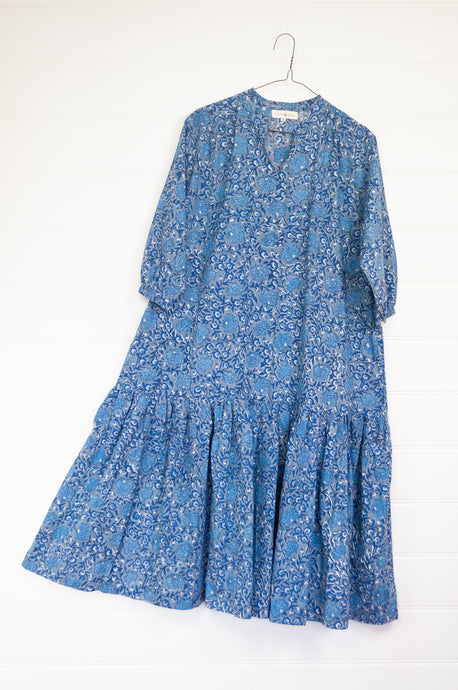Juniper Hearth Gina dress in blue grey floral blockprint, loose fit three quarter sleeve with ruffle skirt.