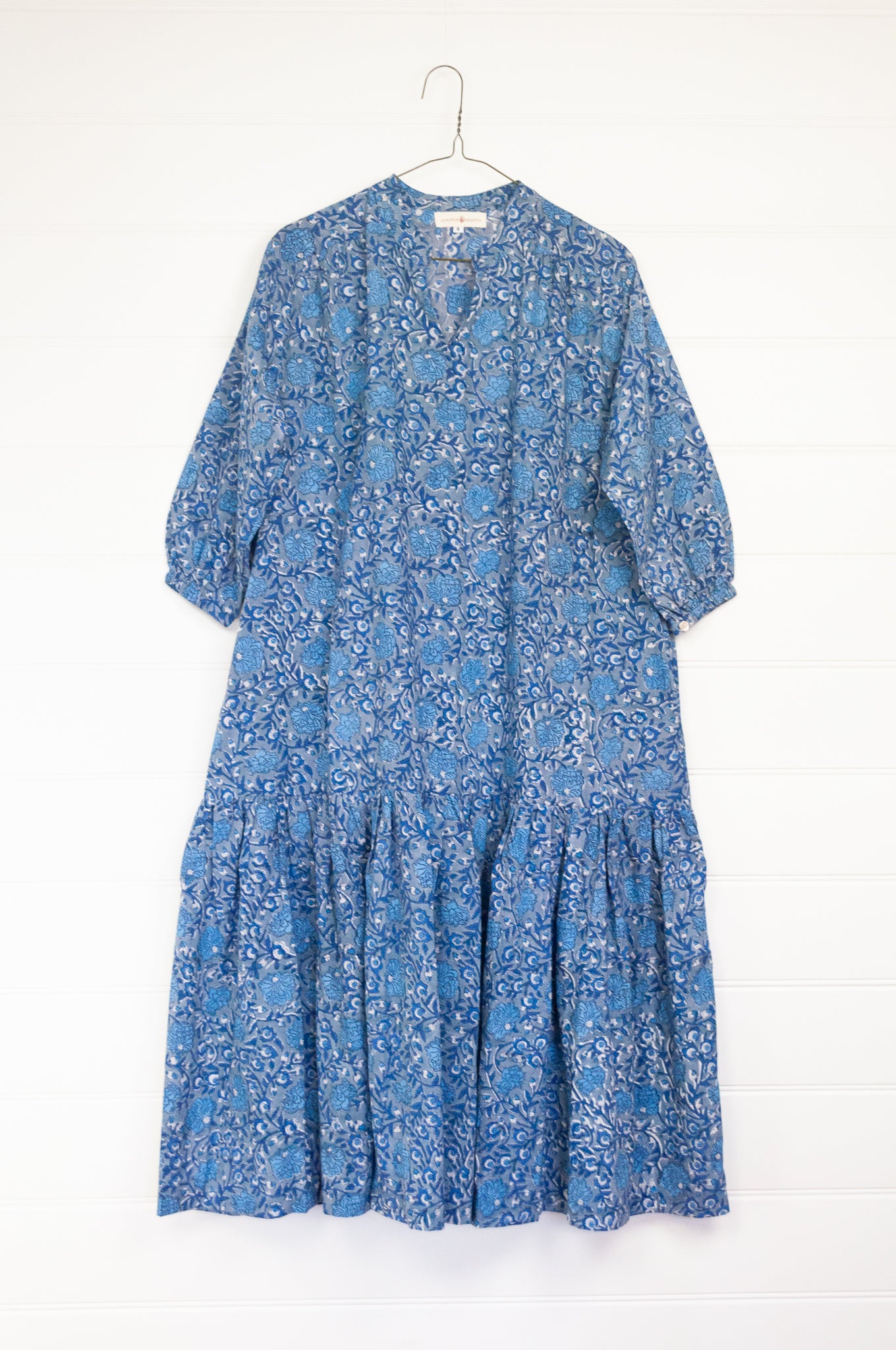 Juniper Hearth Gina dress in blue grey floral blockprint, loose fit three quarter sleeve with ruffle skirt.