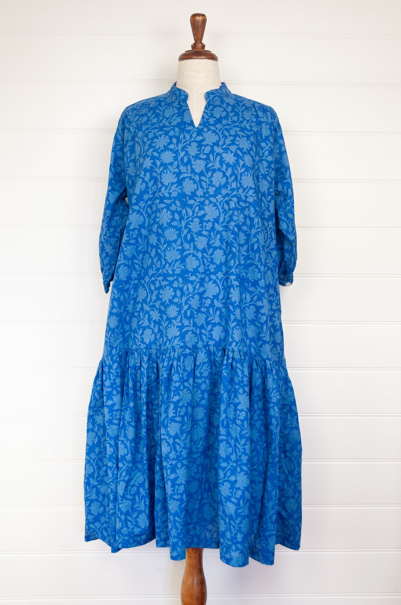 Juniper Hearth Gina dress in cornflower blue floral blockprint in organic cotton, flowy style with three quarter sleeves and deep frill skirt.