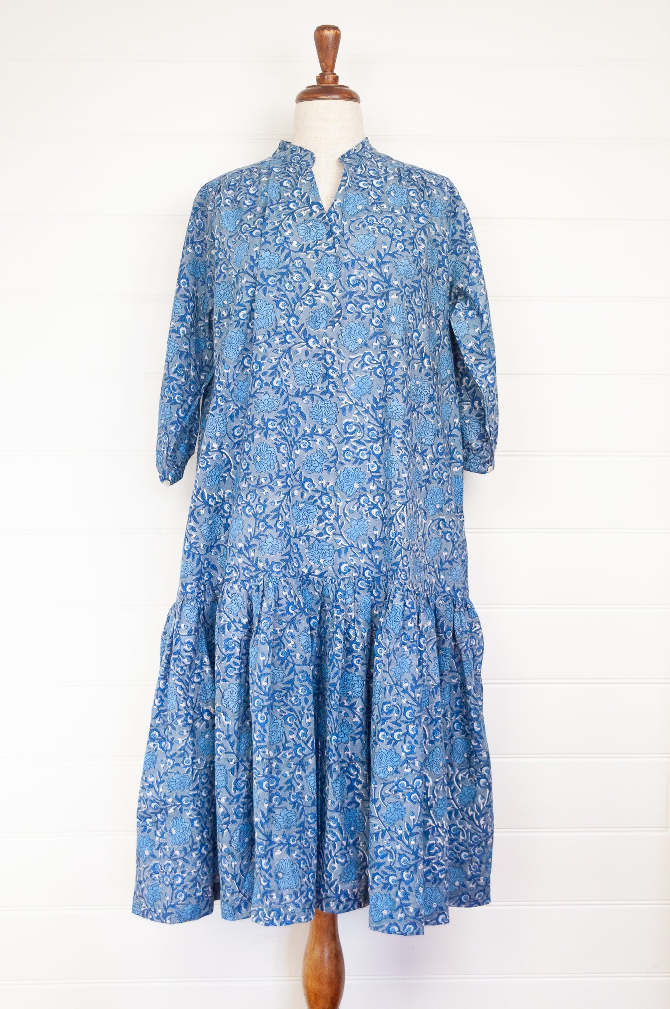 Juniper Hearth Gina dress in blue grey floral blockprint, loose fit three quarter sleeve with ruffle skirt.