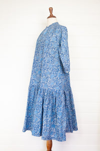 Juniper Hearth Gina dress in blue grey floral blockprint, loose fit three quarter sleeve with ruffle skirt.