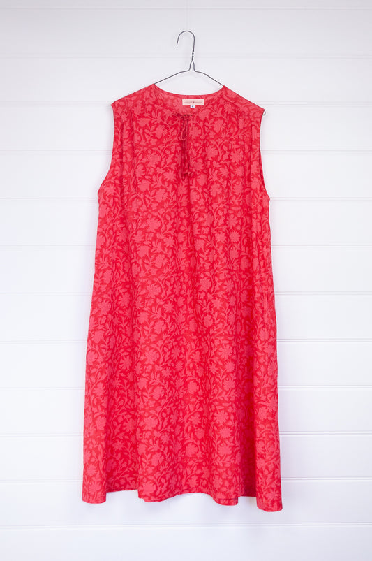 Juniper Hearth Stella dress in cherry pink red blockprint floral cotton, A-line sleeveless with front ties.