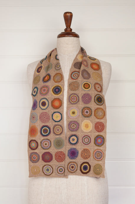 Sophie Digard medium size hand crocheted scarf in colourful FRB palette on neutral background.