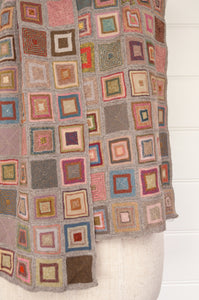 Sophie Digard hand crocheted large merino wool scarf in Square design, patchwork of colourful squares on a neutral background.