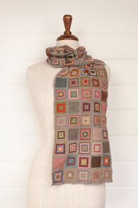 Sophie Digard hand crocheted large merino wool scarf in Square design, patchwork of colourful squares on a neutral background.