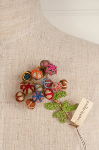 Sophie Digard handmade linen flower brooch in warm colours.