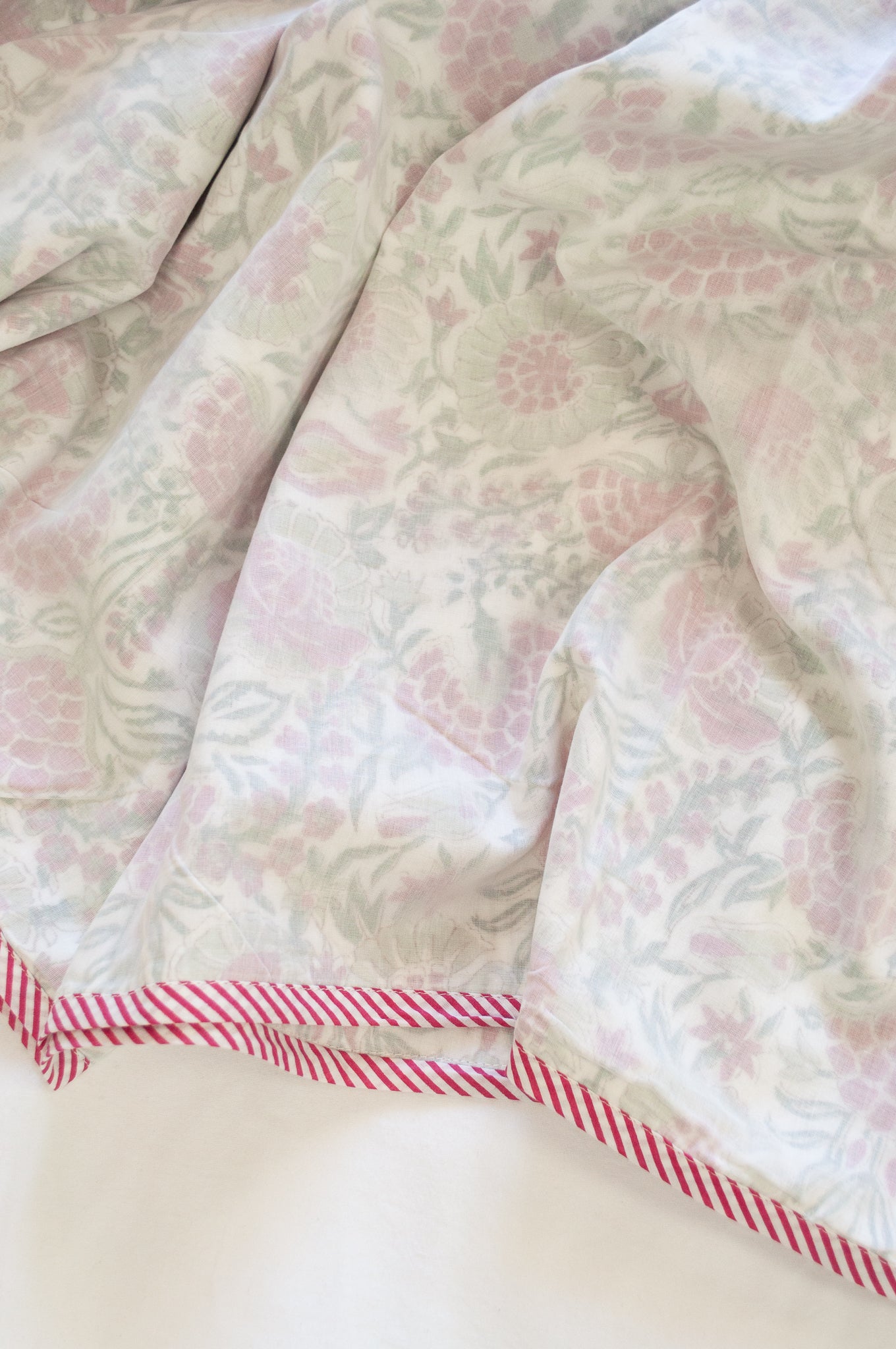 Pure cotton muslin dohar with blockprinted centre in red and green floral carnation design.