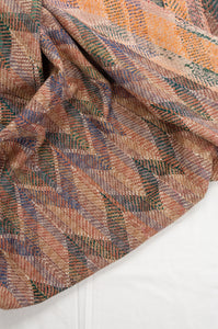 Vintage lohori wave stitch kantha on colourful fabric.