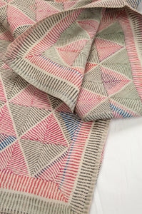 Vintage lohori wave kantha quilt red, blue and olive diamond stitch pattern on white.