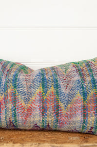 Lohori kantha stitch quilt cushion cover in multi coloured stitching on stripe background.