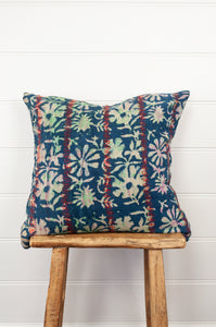 Vintage kantha quilt blockprint cushion overdye in indigo floral design with red top stitching.