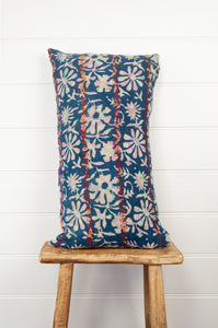 Vintage kantha quilt blockprint bolster cushion overdye in indigo floral design with red top stitching.