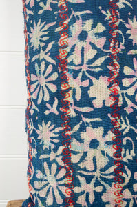 Vintage kantha quilt blockprint bolster cushion overdye in indigo floral design with red top stitching.