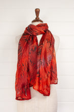 Load image into Gallery viewer, Tie dye silk scarf in shades of orange, magenta and bronze.