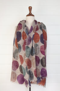 Juniper Hearth fine wool and modal scarf with multi coloured large dots on a beige background.