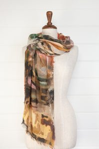 Juniper Hearth fine wool and modal scarf with an earth toned abstract landscape print.