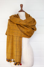Load image into Gallery viewer, Juniper Hearth handwoven baby yak scarf with hand finished details and rainbow tassels in mustard yellow.