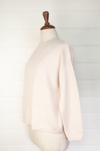 One size crew neck cashmere sweater ethically made in Nepal in blush ecru cream.