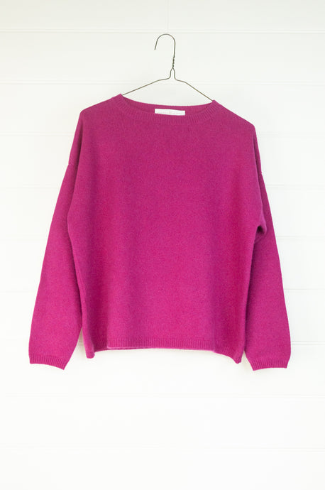 One size crew neck cashmere sweater ethically made in Nepal in vibrant magenta pink.