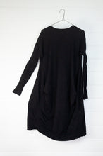 Load image into Gallery viewer, Banana Blue black poly voly tunic with ribbing and panelling and front bagged pockets.