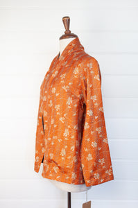 DVE Collection one of a kind reversible silk kantha Neeli jacket has a simple floral print on saffron on one side, and also on the reverse on steel blue.