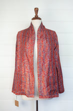 Load image into Gallery viewer, DVE Collection vintage silk kantha reversible Neeli jacket has a traditional paisley print on red on one side, and two emblem prints on the reverse.