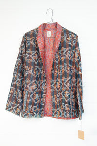 DVE Collection vintage silk kantha reversible Neeli jacket has a traditional paisley print on red on one side, and two emblem prints on the reverse.