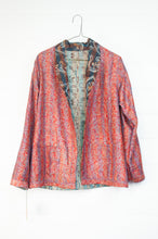 Load image into Gallery viewer, DVE Collection vintage silk kantha reversible Neeli jacket has a traditional paisley print on red on one side, and two emblem prints on the reverse.