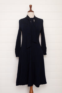 Valia made in Melbourne wool jacquard print fit and flare dress with tie at neck in deep navy ink.