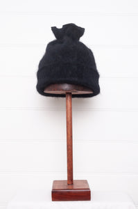 PCNQ black wool woven beanie with gather at top that releases to create a snood, made in Japan.