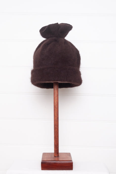 PCNQ brown wool woven beanie with gather at top that releases to create a snood, made in Japan.