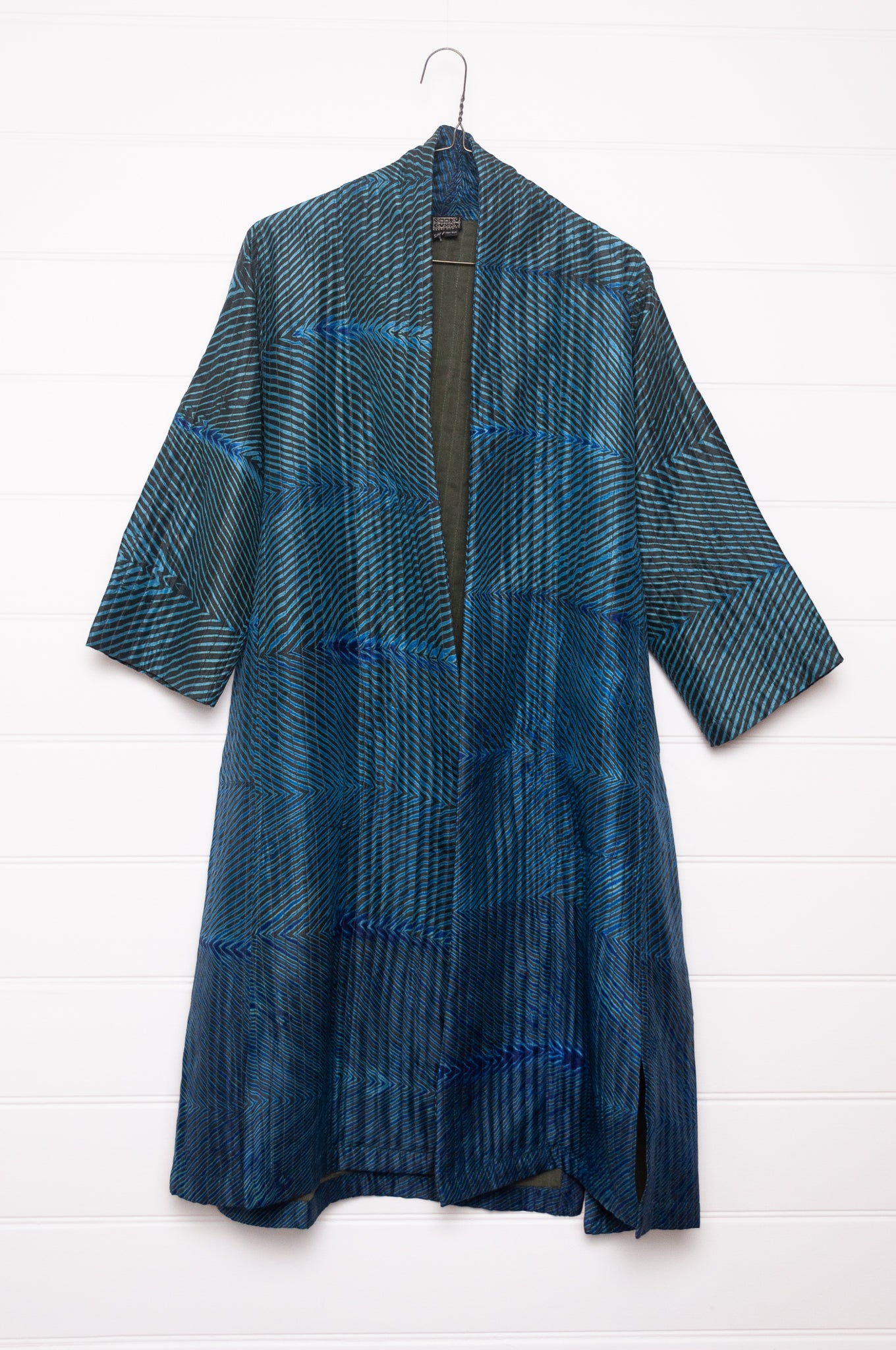 Stunning sapphire and emerald silk shibori coat from Neeru Kumar.