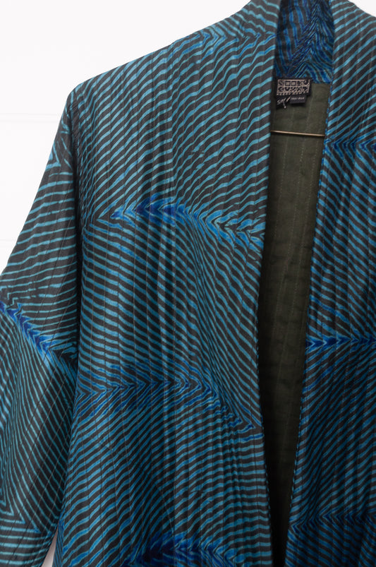 Stunning sapphire and emerald silk shibori coat from Neeru Kumar.