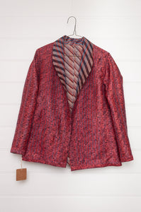 DVE Collection one of a kind reversible silk kantha Neeli jacket has ddiagonal stripe in silver and black on one side, and also on the reverse on deep rose pink.