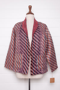 DVE Collection one of a kind reversible silk kantha Neeli jacket has ddiagonal stripe in silver and black on one side, and also on the reverse on deep rose pink.