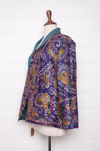 DVE Collection one of a kind reversible silk kantha Neeli jacket has a small floral print on cerulean blue on one side,  and a paisley on the reverse on cobalt blue.