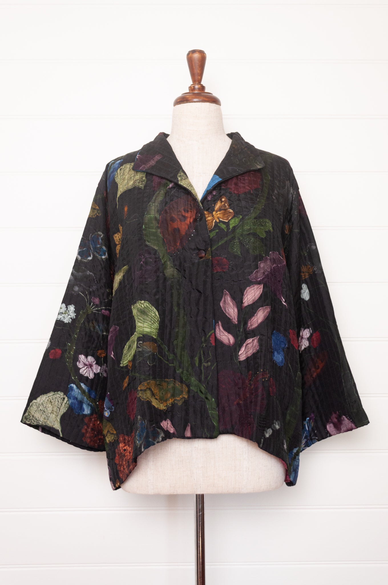 Yavi quilted silk jacket in Vine garden print on ink black, pink block print silk lining.